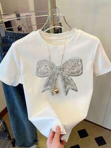 Camiseta de mujer de manga corta y cuello redondo con bordado de lentejuelas en forma de lazo, 56% algodón, estilo minimalista de moda, regalo para amigos - Blanco 5 - Ver 4