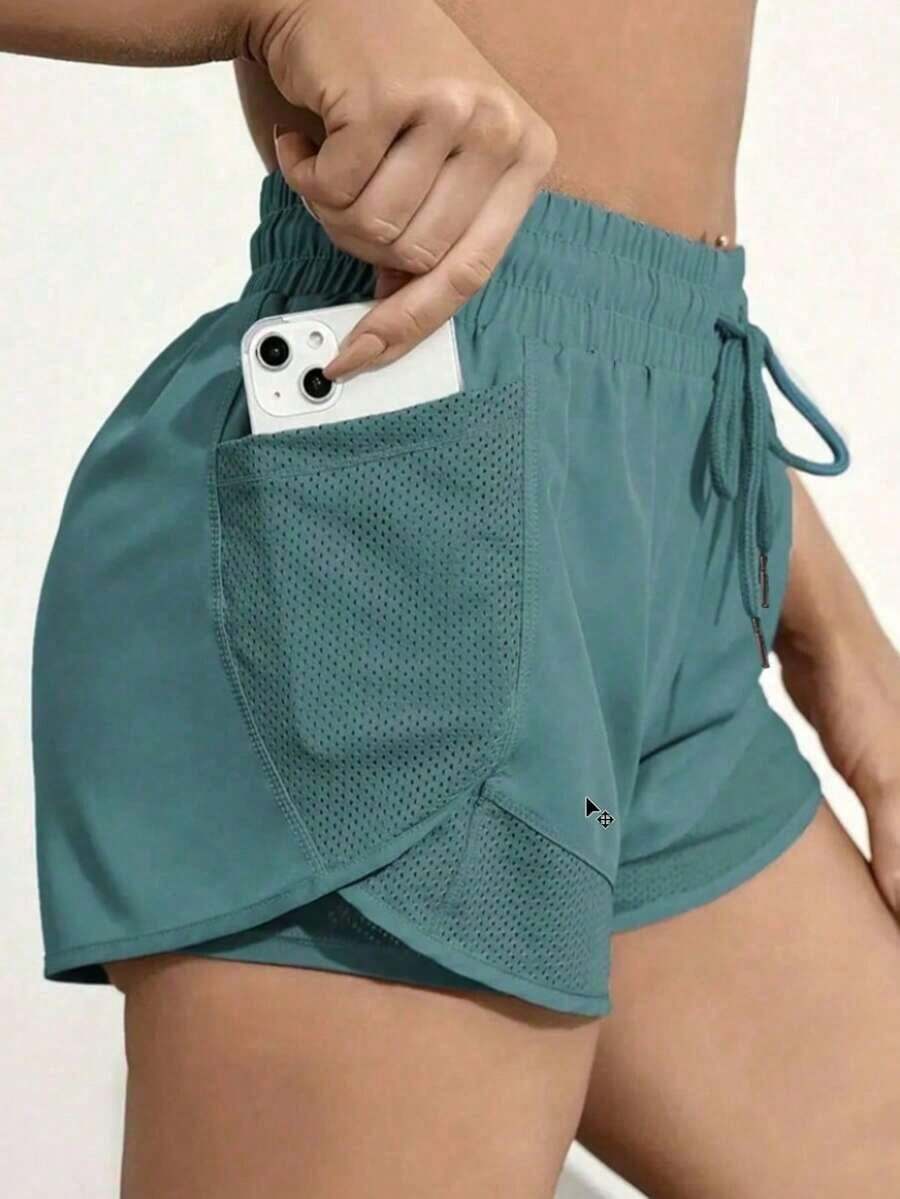 Pantalones cortos de yoga 2 en 1 para mujeres, hechos de tela de secado rápido con bolsillos de malla - Adecuados para fitness casual, entrenamientos en el gimnasio - Ideal para el verano - Diseñado específicamente para mujeres - Perfecto para un estilo de vida activo - Verde - Ver 1