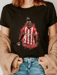 Player In Action Wearing A Red And White Striped Uniform Symbolizing Passion For Football, Dynamic Energy, And Modern Sportsmanship. Comfortable And Attractive Casual Women's T-Shirt. - 黑色 - 查看 1