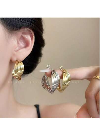1 par de pendientes de aro elegantes y retorcidos para mujer
