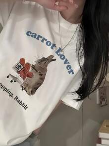 Short-Sleeved T-Shirt With A Rabbit Print And Blue Lettering, Y2K Style. New Summer Fashion For Women, Versatile, Loose-Fitting, Round Neck, Y2K Top. Suitable For All Occasions. PTTI - White - View 2