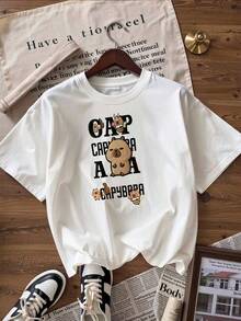 Camiseta con Capybaras Lindas y Texto "Capybara",Camiseta de manga corta de moda para primavera y verano de 2026, hecha en México, 180 gramos. Estampado de dibujos animados, modelo de pareja, apta para uso interior o exterior. Cuello redondo, unisex, ideal para oficina y ocio. Paquete de una pieza. - WH-P631577SLNDXZGY355 - Ver 4