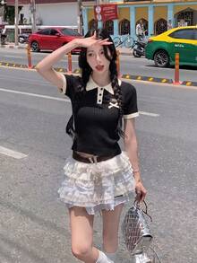 女士米白色和黑色 Polo 衫 - 时尚优雅休闲甜美修身短袖上衣，饰有蝴蝶结标志，适合春夏日常穿着 - 黑色 - 查看 7