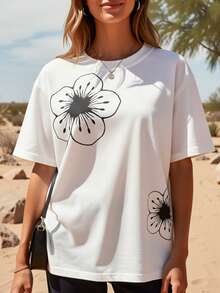 Una camiseta de estilo vintage con estampado floral blanco para mujer, de manga corta y cuello redondo, que presenta un destacado diseño floral, ofreciendo un corte relajado ideal para primavera y verano. Camiseta holgada de color sólido y estilo sencillo, estilo vintage urbano, unisex, de algodón, manga corta y cuello redondo. - Blanco - Ver 2