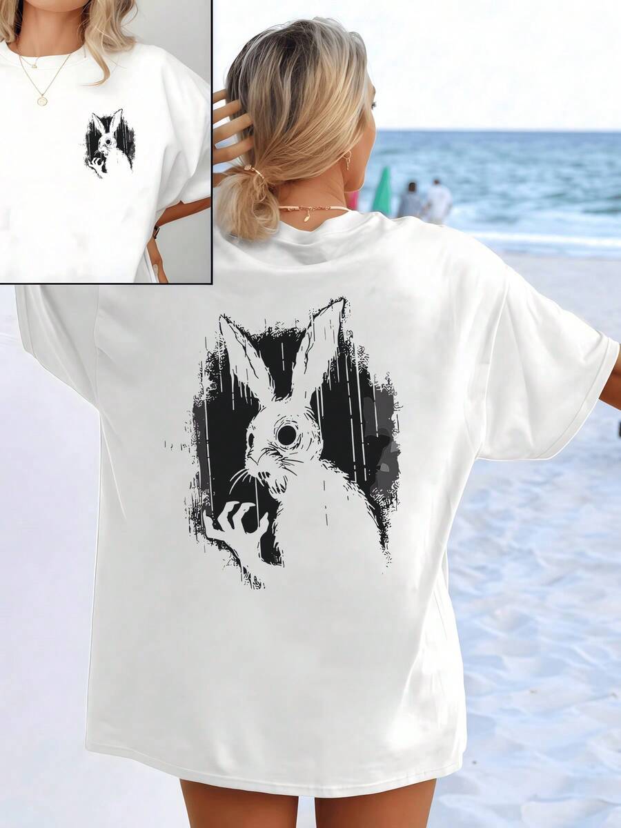 Figure Of A Mysterious Rabbit Observing From The Shadows With One Hand Raised, Representing Curiosity And Inner Energy, On A Delicate White Background. Women's T-Shirt With Elegant And Comfortable Double Print For Everyday Wear. - White - View 1