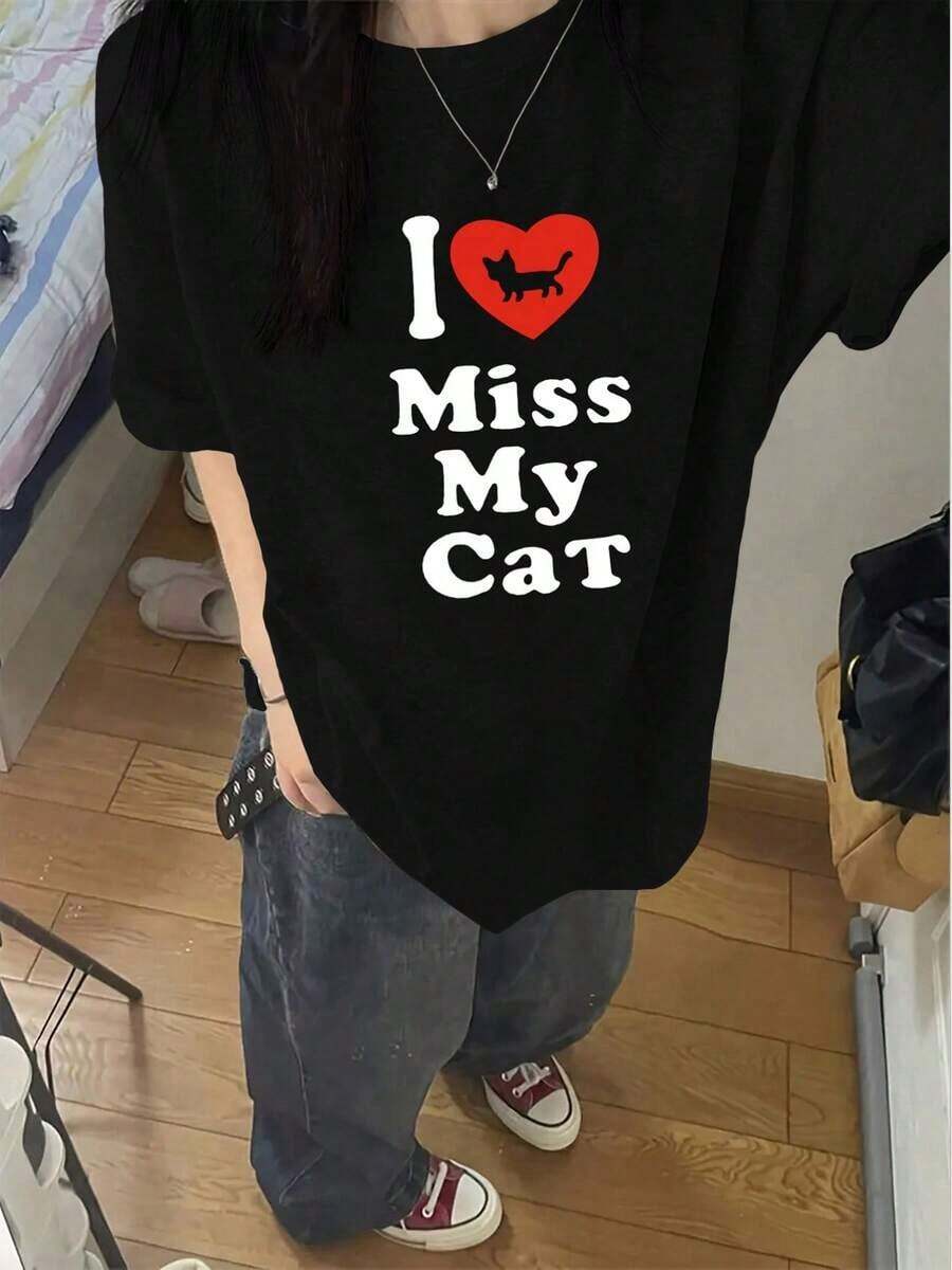 Camiseta de algodón puro nueva de verano 2026, 1 pieza, camiseta de manga corta estampada de moda de verano para mujer, top versátil de cuello redondo holgado con diseño de corazón, top estampado casual y versátil, adecuado para primavera, verano y otoño. - Negro - Ver 1