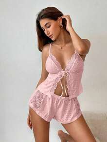 El traje de encaje negro de la señora es tanto romántico como sexy.Es adecuado para fiestas y también se puede usar para combinaciones de ropa de temporada.Combina materiales de punto y encaje y tiene un lazo en la cintura.Este es un conjunto de - Rosa - Ver 7