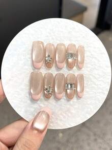 Bộ 10 móng giả tự làm chất lượng cao, cảm giác sang trọng, được làm thủ công với họa tiết hình trái tim đính đá và thiết kế phá cách. Móng tay kiểu Pháp màu hồng hình mắt mèo phù hợp cho phụ nữ và các cô gái đeo trong các buổi tiệc khiêu vũ và tụ họp hàng ngày. Móng giả đi kèm keo dán dạng gel và miếng dán có thể tháo rời và tái sử dụng. - Nhiều màu - Xem 11