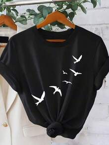 Camiseta gráfica de estilo moderno para mujer - Diseño de golondrina voladora, cuello redondo casual, manga corta, suave rosa con silueta negra, perfecta para verano, deportes y vacaciones, top de tempor completa Estampado de animales juguetones Tejido elástico - Negro - Ver 2
