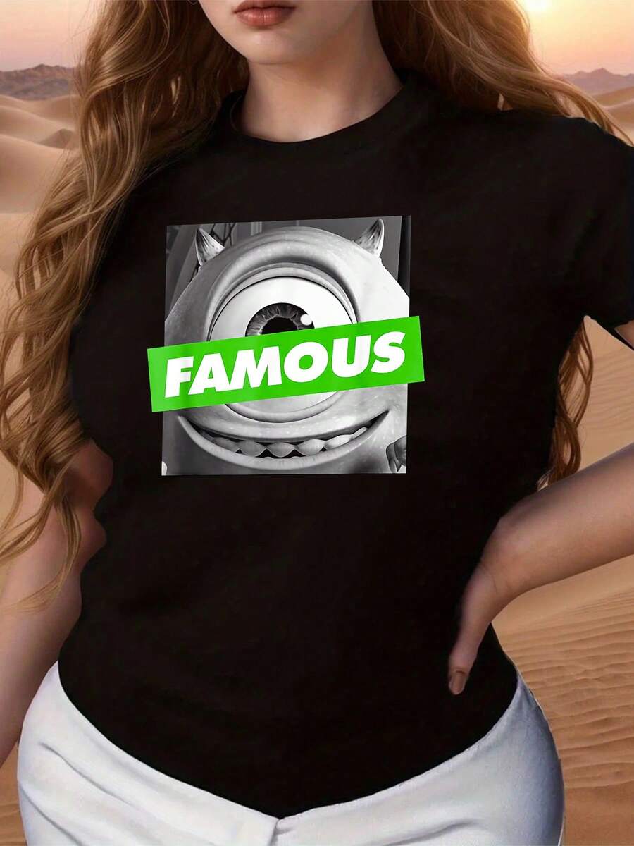Graphic Featuring A Funny One-Eyed Black And White Character With The Word FAMOUS In Bright Green Symbolizing Confidence, Humor, And Positive Energy. Comfortable And Modern Casual Women's T-Shirt - 黑色 - 查看 1
