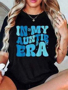 Women's 100% Cotton Short-Sleeved T-Shirt With A Round Neck And Relaxed Fit, Perfect For Everyday Summer Wear. This Blue T-Shirt Features A Print That Reads "In My Aunt Era, Baby Announcement For Aunt, Mother's Day." A , Printed, Short-Sleeved T-Shirt With A Round Neck, Ideal For Vacations. Made Of Pure Cotton, This T-Shirt Is Breathable, Soft, And Casual. - 黑色 - 查看 1