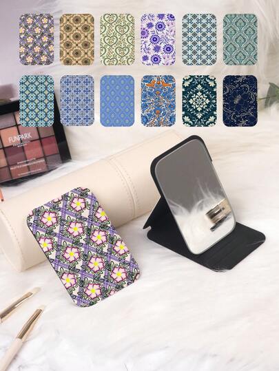 1 chiếc gương trang trí nhỏ gọn, gấp gọn, họa tiết hoa văn nghệ thuật, nhẹ, di động, chất liệu da PU bền, phù hợp cho mọi dịp, thiết kế họa tiết hoa hình học cổ điển, cấu trúc gấp tinh tế, chắc chắn và chống sốc, tiện lợi khi cầm nắm.