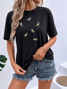 Playera Minimalista con Flores - Estilo Chic y Versátil para Uso Diario - Negro - Ver 1