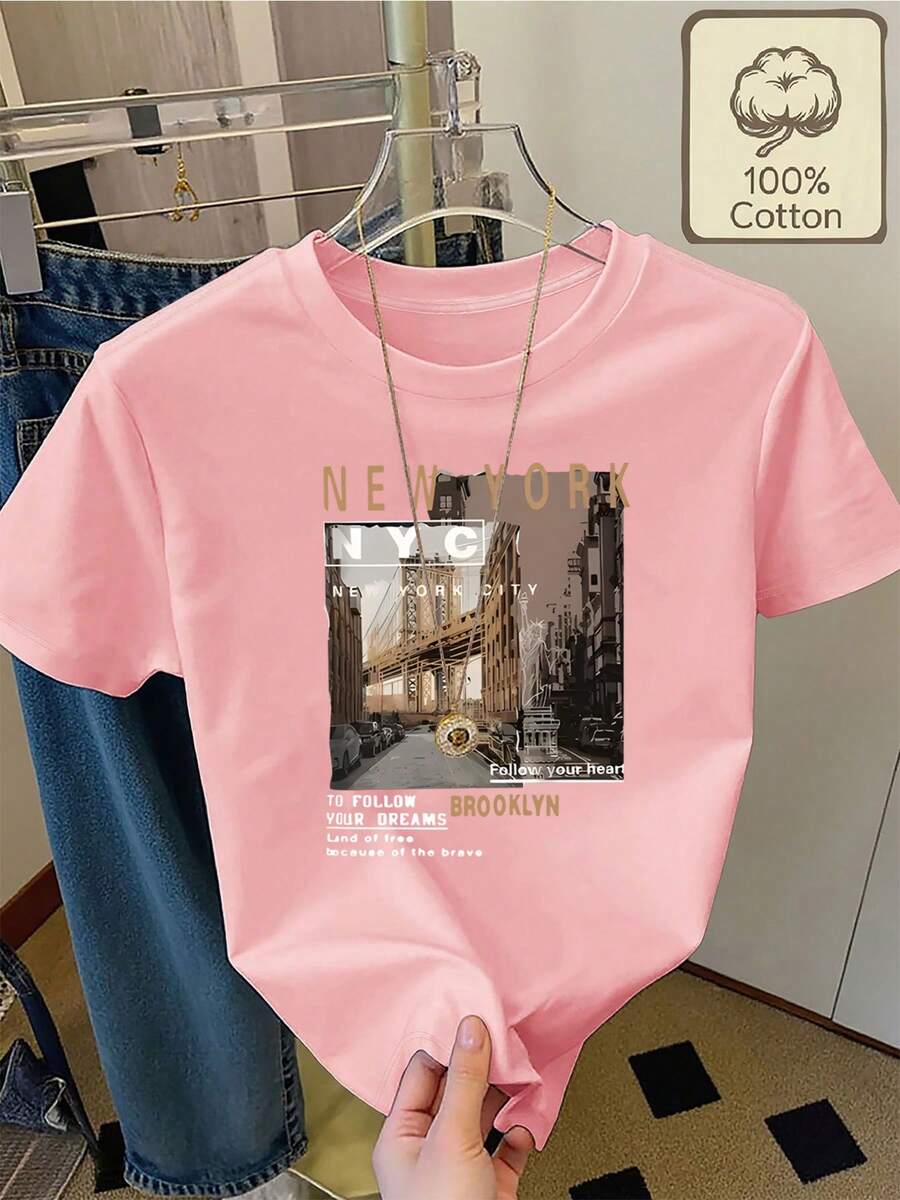 Camiseta 100% con paisaje de la ciudad de Nueva York y estampado de texto motivacional, cuello redondo, manga corta, ropa de verano casual, cómoda y transpirable para mujer - Rosa - Ver 1