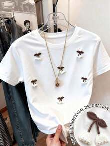 Camiseta de mujer de manga corta y cuello redondo con bordado de lentejuelas en forma de lazo, 56% algodón, estilo minimalista de moda, regalo para amigos - Blanco 4 - Ver 1