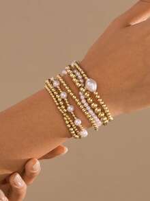 Conjunto de 7 pulseiras elásticas multicamadas com pérolas sintéticas douradas e miçangas da CCB. Elegante, estilosa e criativa, esta pulseira dourada é perfeita para usar no dia a dia, em viagens e festas. - Ouro amarelo - Ver 2
