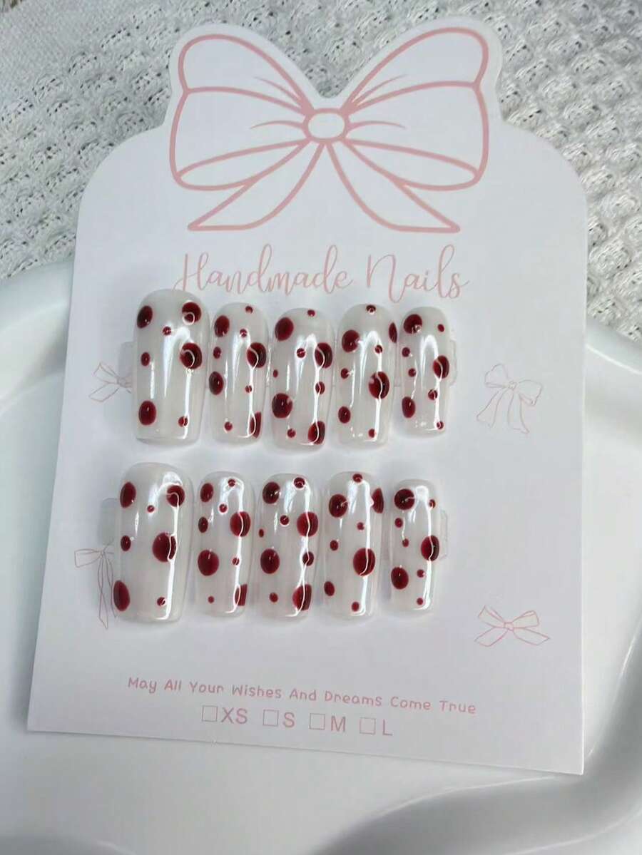 10片纯手工制作的极光白美甲贴片,带有红色波点细节,沙龙品质可重复使用假指甲 - 白色 - 查看 1