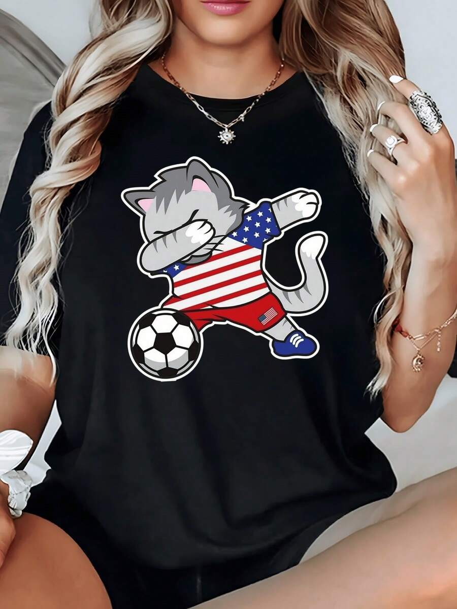 Funny Cat Wearing A Red And Blue Striped Shirt Striking A Dance Pose While Playing With A Ball, Representing Youthful Energy And Joy. Comfortable Casual Women's T-Shirt For Summer - 黑色 - 查看 1