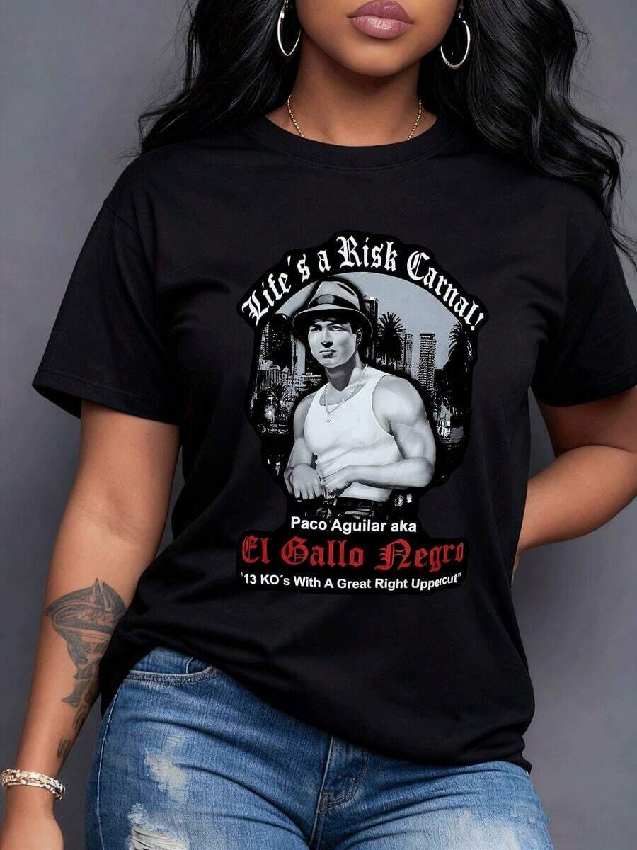 A Man In A Hat And Vest In A Cityscape With 'Life's A Risk, Carnal!' And The Name 'Paco Aguilar' With '13 KOs With A Great Right Uppercut' Symbolizes Courage, Strength, And Determination In The Face Of Challenges. This Is A Women's T-Shirt Ideal For Enhancing Your Bold Personality. 100% Cotton, Casual Short Sleeves. - 黑色 - 查看 1