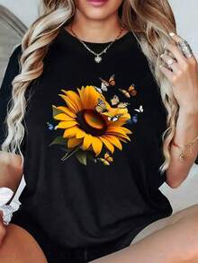 Large Sunflower Symbolizing The Energy Of The Sun And Hope, Surrounded By Butterflies Representing Freedom And Renewal. Women's T-Shirt, 100% Soft And Comfortable Cotton. - 黑色 - 查看 1