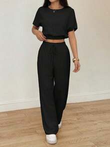 Conjunto de dos piezas con top corto de manga murciélago y pantalones con cordón en la cintura, de tela texturizada.Conjunto de dos piezas casual, cómodo y para tallas altas para mujeres. - Negro - Ver 3