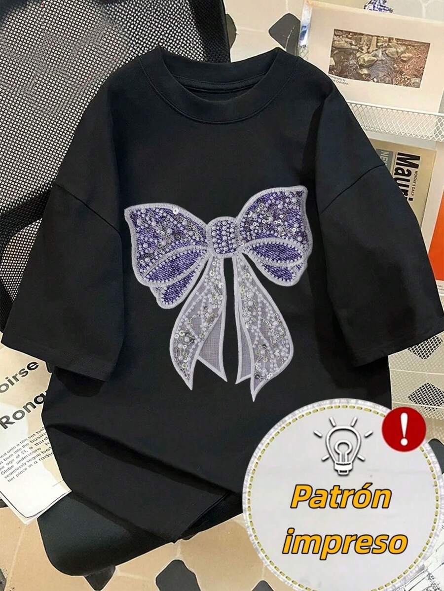 Women's T-Shirt With A Large, Shiny Bow Print, Featuring A Purple Sequined Top And Translucent White Ribbons, In A Sweet And Decorative Style. - Black - View 1