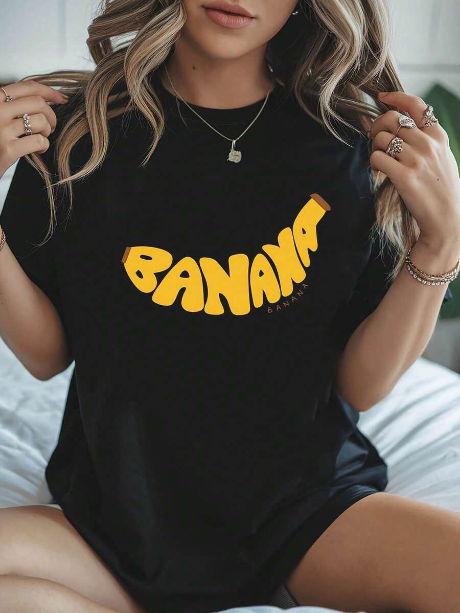 Nueva Camiseta de Moda para Mujer con Cuello Redondo y Estampado Divertido de Plátano, estilo casual, diseño básico universal, versátil y listo para el verano. - Negro - Ver 1