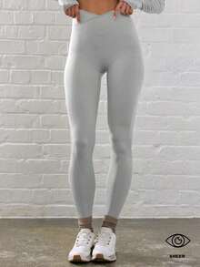 Sport Leggings ajustados de cintura contorneada y cruzada para actividades, pádel, tenis, pickleball, gimnasio, fitness, pilates y uso casual diario - Gris Claro - Ver 6