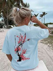 Camiseta holgada de estilo japonés con estampado de flores de cerezo para mujer, 100% algodón, transpirable, de cuello redondo y manga corta, ropa de calle Y2K, adecuada para salidas de primavera, paseos urbanos y uso diario casual, color rosa de verano. - Celeste - Ver 7