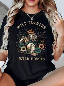 Image Of A Cowgirl Riding A Horse Surrounded By Horseshoes And Wildflowers Symbolizing Freedom And Inner Strength. Women's T-Shirt, 100% Cotton, Comfortable And Modern. - 黑色 - 查看 1