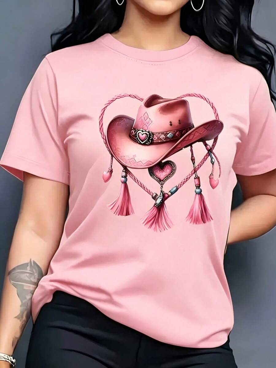 Camiseta de mujer de manga corta, estampado de sombrero vaquero, sombrero vaquero rosa decorado con nudo de cuerda en forma de corazón y borlas, prenda en color rosa claro, cuello redondo casual - PALO DE ROSA - Ver 1