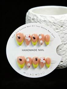 10 Pieces Of Hand-Made Almond-Shaped Press-On False Nails In A Vibrant And Playful Style. With A Sheer Nude Base, They Feature Hand-Painted French Tips In Lemon Yellow, Paired With 3D Black Ladybugs And White Petals. Cute And Lovely, They Are A Must-Have For Sweet Girls And Come With A Tool Kit. Handmade Press On Nails - Yellow - View 2