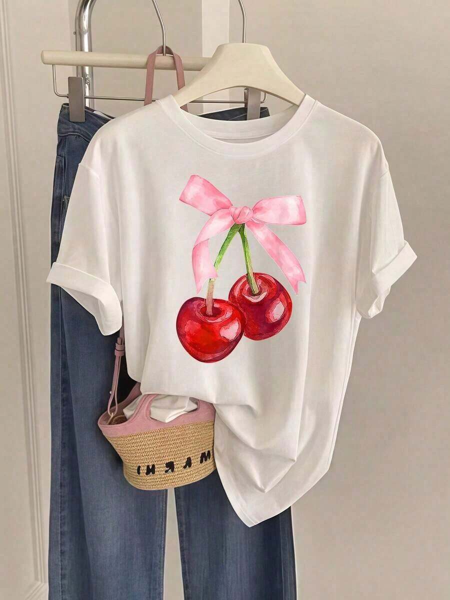 Camisetas de manga corta de talla grande para mujer, ideales para el verano y el uso diario, nuevas camisetas de mujer 2026 con estampado de cerezas y lazo rosa, un regalo de verano a la moda, adecuadas para fiestas y uso diario, transpirables y cómodas. - Blanco - Ver 1