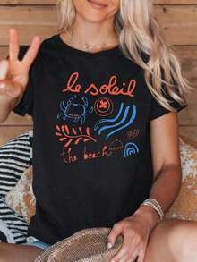 CasualPlayera negra de mujer con estampado de playa, cangrejo y olas, camiseta casual de manga corta, cuello redondo, blusa cómoda estilo verano para vacaciones, viaje y outfits casualesMust-have - Negro - Ver 1