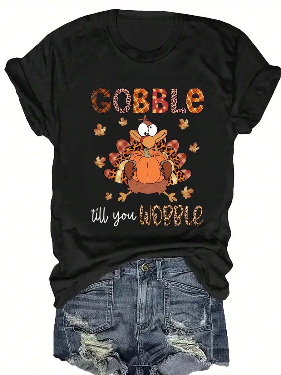 Camiseta Gráfica Rosa de Talla Grande para Mujer con la Frase "Gobble Till You Wobble" - Cuello Redondo Casual, Manga Corta, Diseño Temático de Otoño y Halloween con Calabaza y Hojas de Otoño, Ropa Casual|Estampado Divertido|Tela Elástica - Negro - Ver 1
