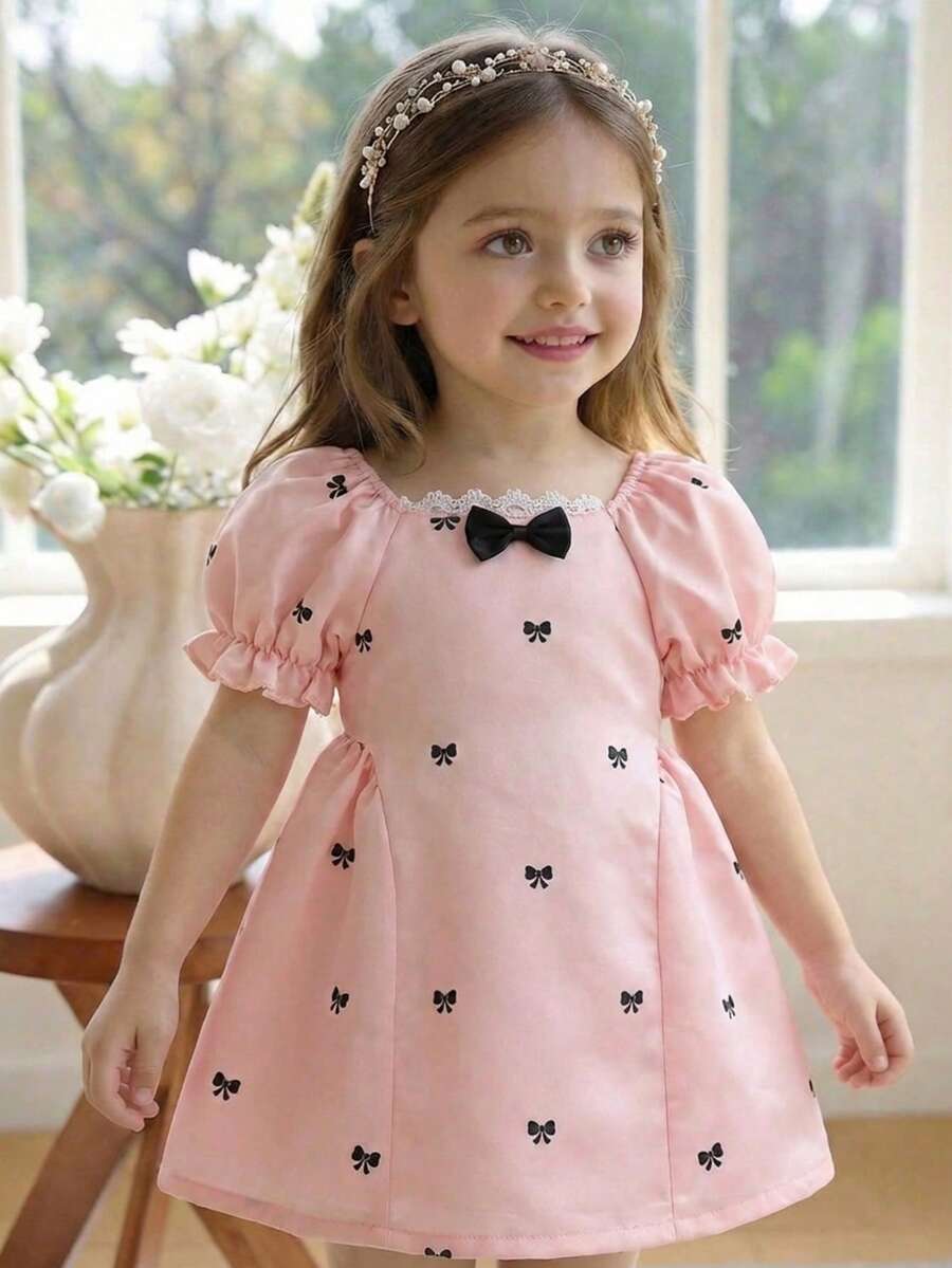 Đầm công chúa mini tối giản cho bé gái, cổ bèo nhún, tay áo cánh hoa, in hình nơ, thích hợp cho mùa hè. - Hồng - Xem 1