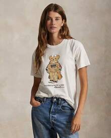 Camiseta de manga corta casual con estampado de oso para mujer, estilo europeo y americano, nueva colección de verano 2026, cómoda y holgada, camisetas a la moda. - Blanco - Ver 1