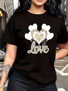 Camiseta de mujer con estampado de corazón negro y dorado y estampado de leopardo negro y dorado, cuello redondo casual, manga corta, tela elástica de elasticidad media, talla grande 2026, camiseta ligera de verano, ajuste regular, casual, transpirable, esencial para el uso diario, ropa versátil, aspecto moderno, material cómodo, manga corta para jóvenes adultos. - Negro - Ver 1