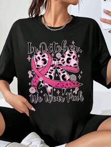 In October We Wear Pink Breast Cancer Awareness T-Shirts With A Leopard Print Ribbon And Bow Design For Women, A Fashionable Garment That Expresses Support For Breast Cancer, Ideal As A Gift For October Awareness Month. - Black - View 7