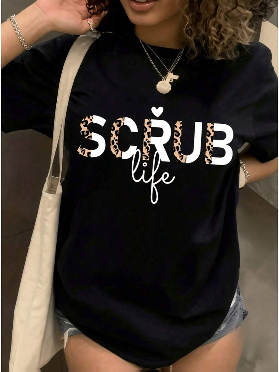 Camiseta deportiva casual para mujer con letras estampadas en leopardo - Camiseta negra elástica de cuello redondo, lavable aáquina, de ajuste cómodo para todas las estaciones. Prenda de ocio con un toque audaz y tejido opaco. - Negro - Ver 1