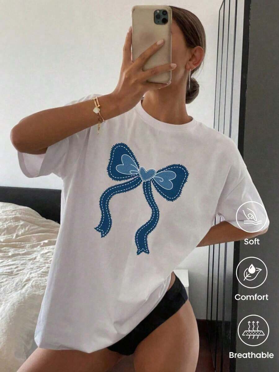 Camiseta de cuello redondo y mangas cortas de ropa fashion, fabricada en México, para la temporada primavera-verano 2025. Con estampado de dibujos animados, es un modelo de pareja, apta para usar tanto por dentro como por fuera, ideal para oficina y estilo casual, diseñada para hombres y mujeres, en unidad individual. - Blanco - Ver 1