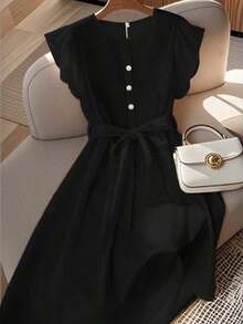 Vestido de mujer de longitud media, cómodo y suave, sin estiramiento, con cuello redondo, mangas de vuelo, cintura elástica, decoración de botones de perla, estilo francés elegante y versátil para vacaciones y viajes, color albaricoque, primavera - Negro - Ver 1