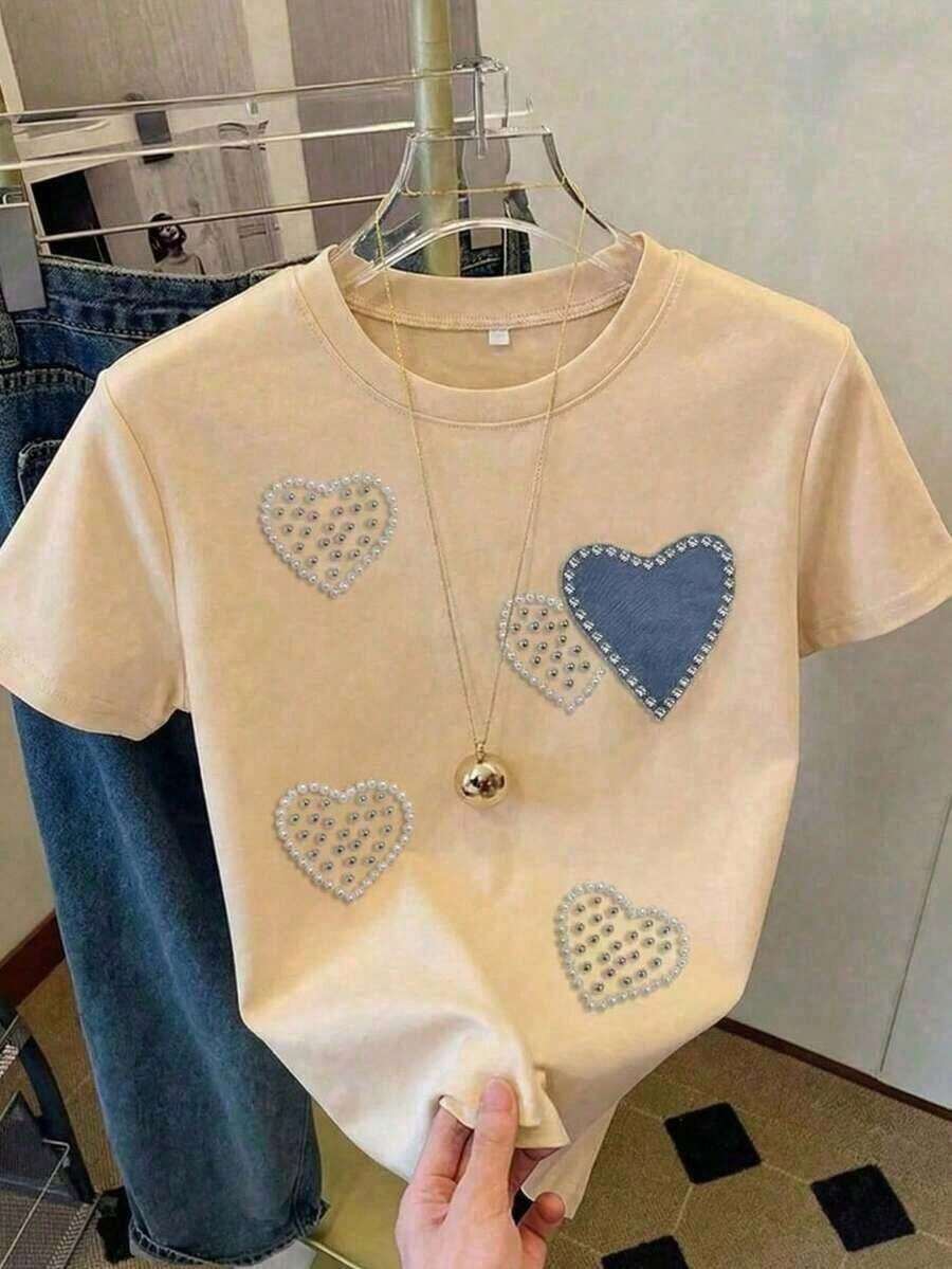 Camiseta de mujer de manga corta con cuello redondo, holgada, casual y versátil. Con un estampado moderno, elegante y sofisticado de letras simples, ideal como prenda básica; confeccionada con tela suave y excelente caída - Camiseta unisex de manga corta y cuello redondo de algodón suelto estilo vintage urbano. - Albaricoque 1 - Ver 1