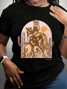 Camiseta de mujer con estampado de escena del desierto con vaquero montando a caballo, cactus y puesta de sol, estilo boho, para aventuras al aire libre y uso casual. - Negro - Ver 1