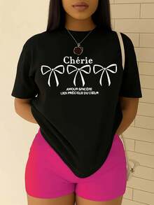 1 pieza de camiseta Cherie para mujer con estampado de la frase en francés y lazo. |   Estampado en negro, cuello redondo, mangas cortas, top casual, ajuste cómodo para todas las estaciones, lavable a máquina, tela de fácil cuidado, ropa casual versátil y camiseta, camisa de mujer con estampado moderno 180g 100% algodón. - Negro - Ver 5