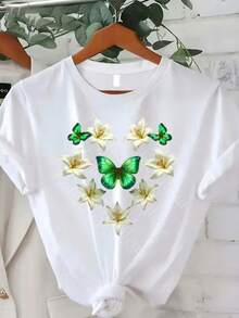 Camiseta de Verano Premium Estampada para Mujer, Talla Grande, Manga Corta, Blanca, Cuello Redondo con Dobladillo Anudado, Decorada con Patrones de Mariposas Verdes y Lirios Blancos, Ideal para un Look Floral Fresco de Verano y Uso Diario Casual. - Blanco - Ver 1