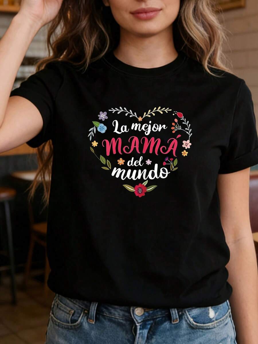 Camiseta holgada de mujer para primavera/verano con diseño floral de corazón y estampado en español "La mejor MAMÁ del mundo". Ideal para el Día de la Madre, cumpleaños de mamá, reuniones familiares españolas, regalo para mamá española. Prenda de manga corta cálida para uso social, ropa de calle cotidiana con un estilo veraniego elegante y práctico. - Negro - Ver 1