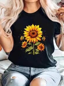 Camiseta de Mujer: Esta camiseta casual de cuello redondo presenta un diseño retro de girasoles en tonos neutros, lo que la hace perfecta para la primavera y el verano. Esta cómoda camiseta negra muestra estampados de girasoles en naranja y amarillo brillantes y es lavable a máquina. - Negro - Ver 6