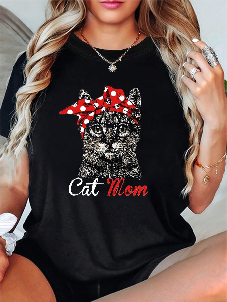 A Cat Mom's Pride: Plus Size Women's Casual Fashion T-Shirt With Round Neck, Cat Print, Red And White Polka Dot Headband, And Glasses. - 黑色 - 查看 1