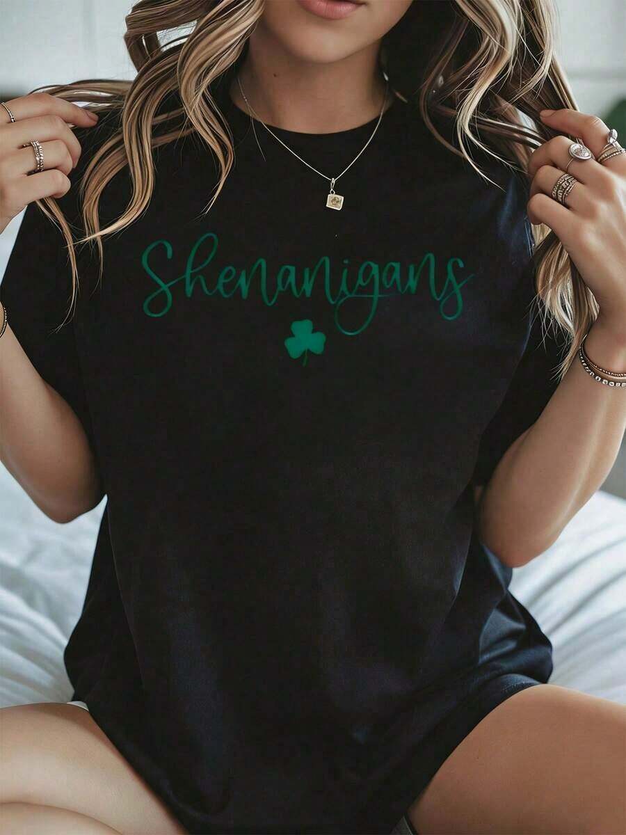 Elegante y casual para mujer, manga corta, camiseta blanca con estampado de trébol para el Día de San Patricio, ropa casual para primavera y verano. - Negro - Ver 1